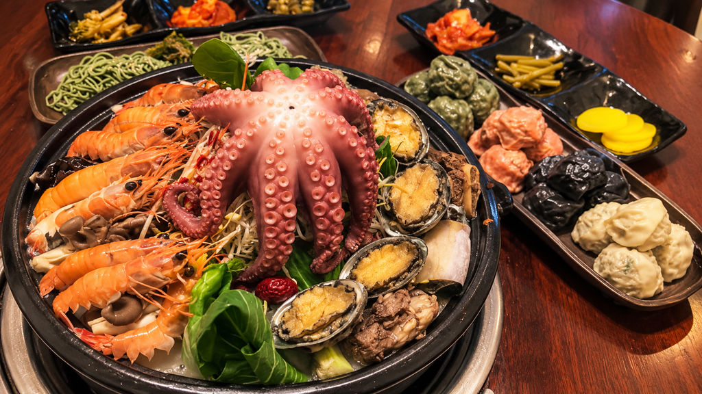 Seafood hot pot with octopus, abalone, shrimp and colorful handmade dumplings at Jangin's House in Jeju