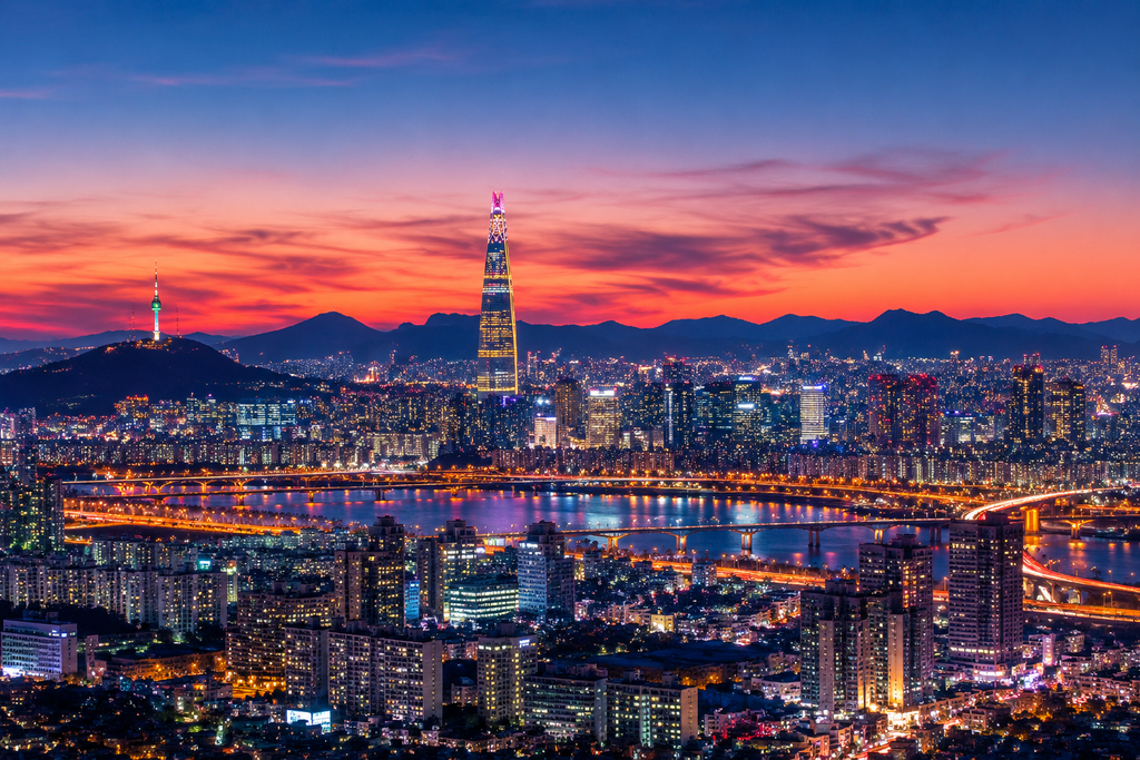 Seoul skyline and Han River at sunset with N Seoul Tower and Lotte World Tower