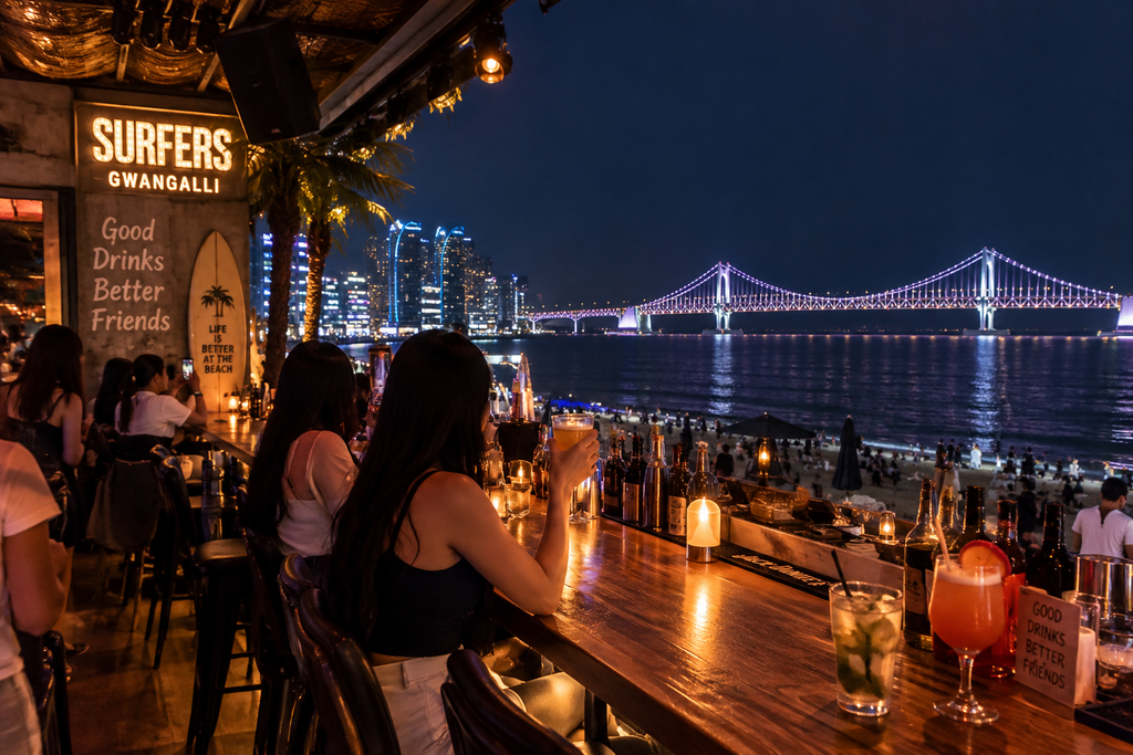 Beachfront pub overlooking Gwangandaegyo Bridge at night in Busan