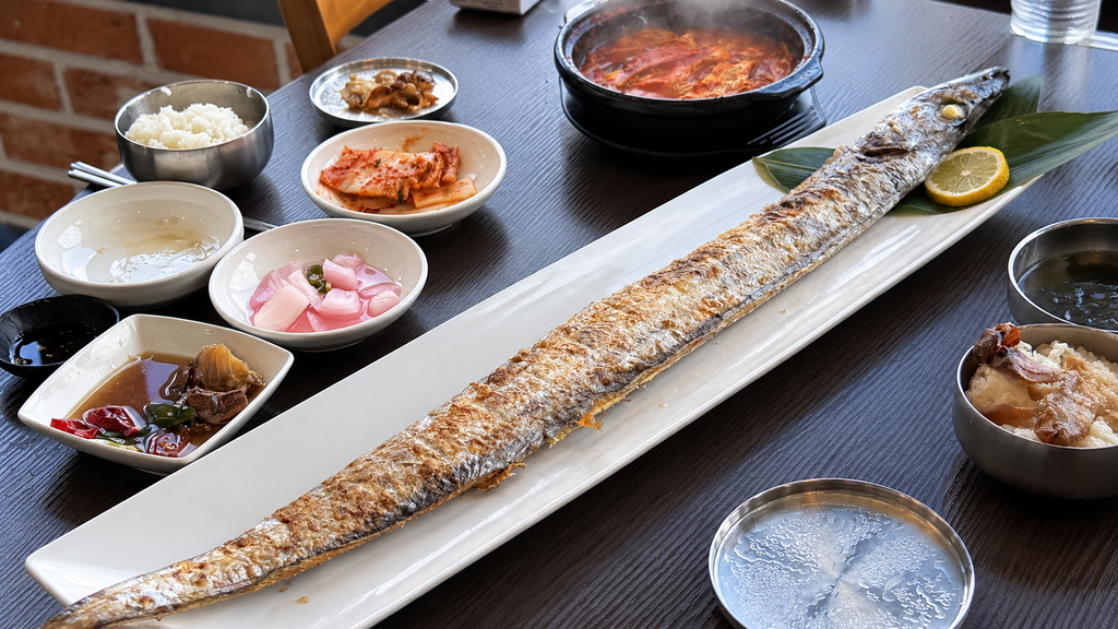 Grilled hairtail fish with Korean side dishes in Jeju